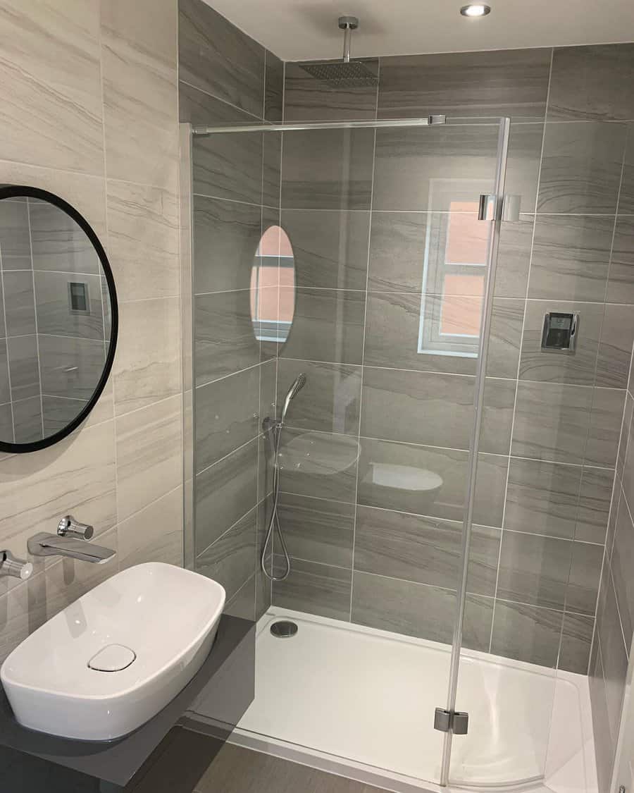 grey bathroom with glass dividers