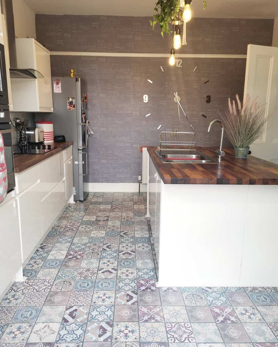 Kitchen with decorative tiled floor and grey brick wall