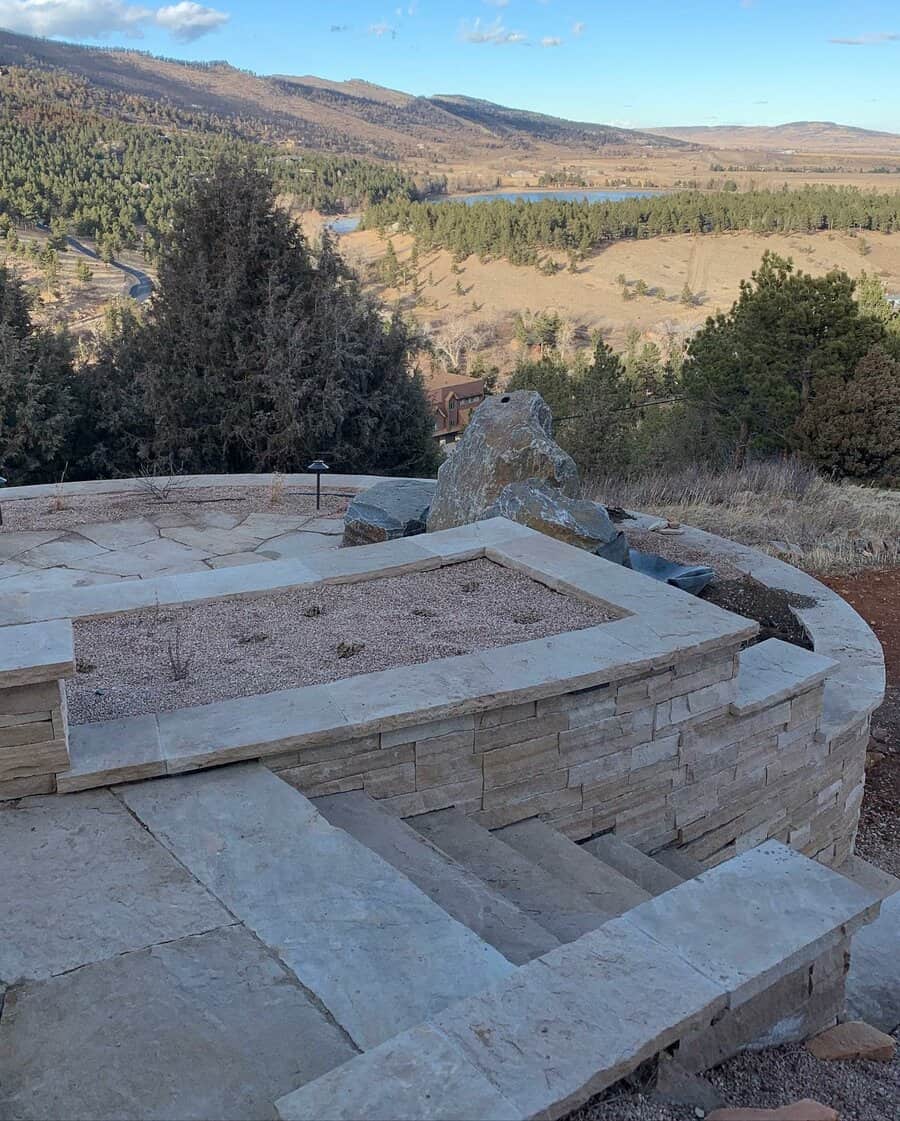 Patio with fire feature and scenic mountain view