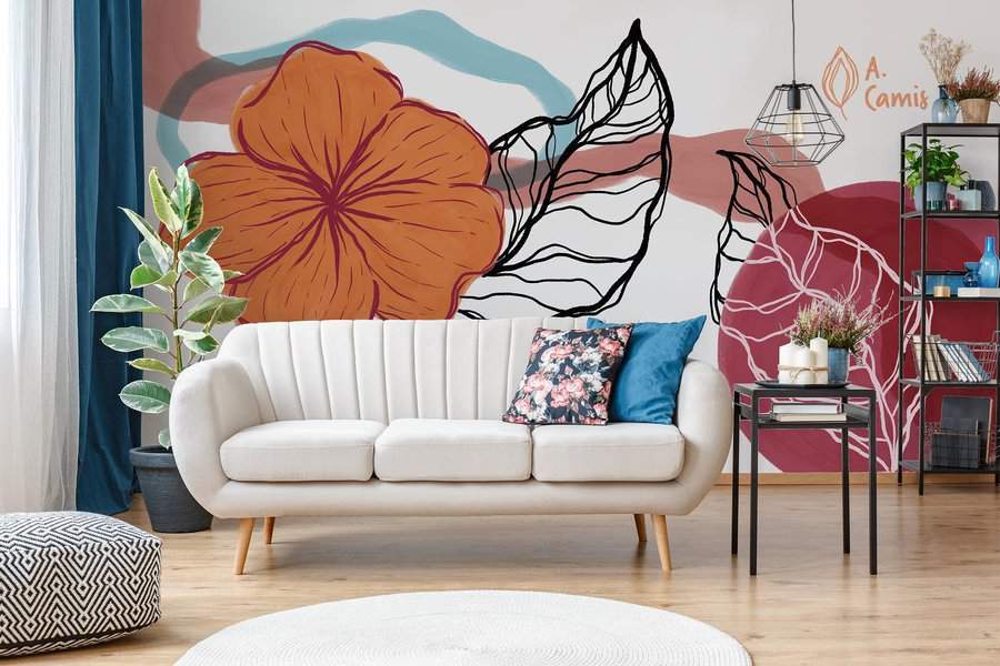 Modern living room with a white sofa, vibrant wall art, and a large houseplant