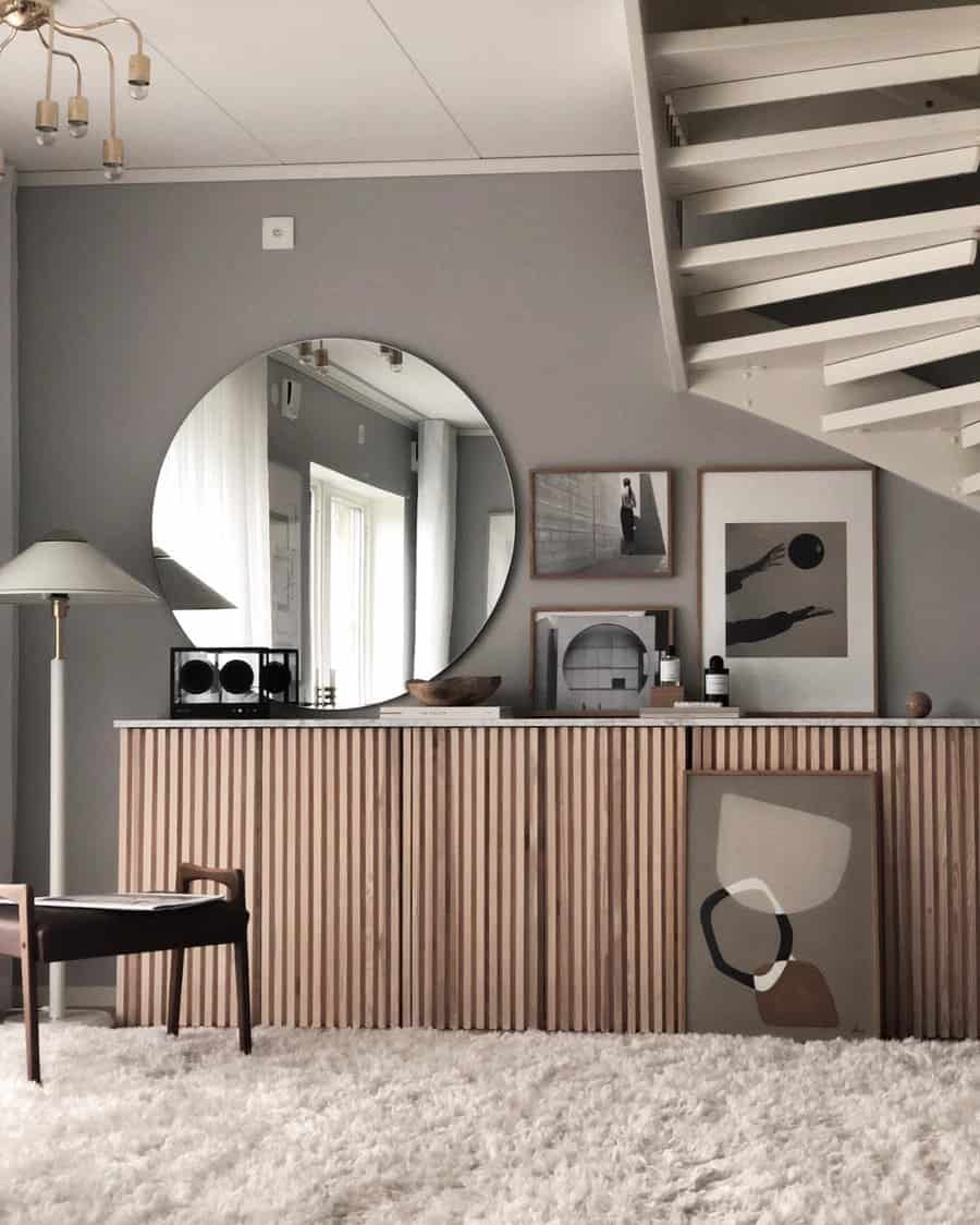 A room with gray walls and a neutral toned wooden cabinet