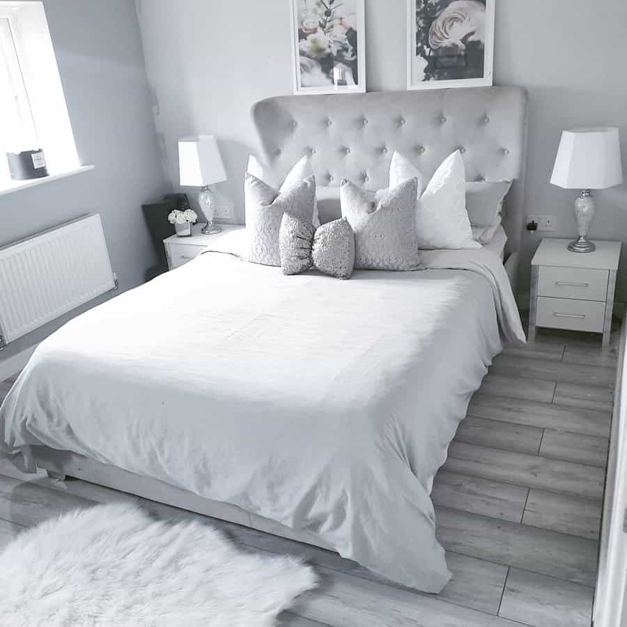 grey bedroom with monochromatic wall art 