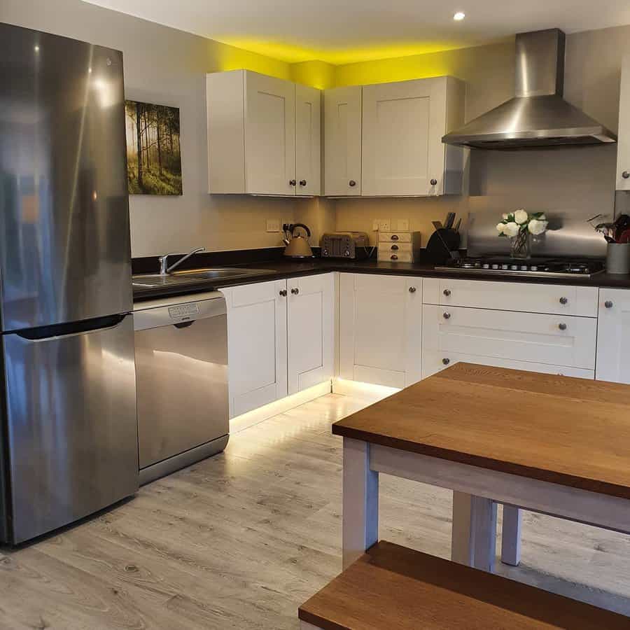 Modern kitchen with wood accents and ambient lighting