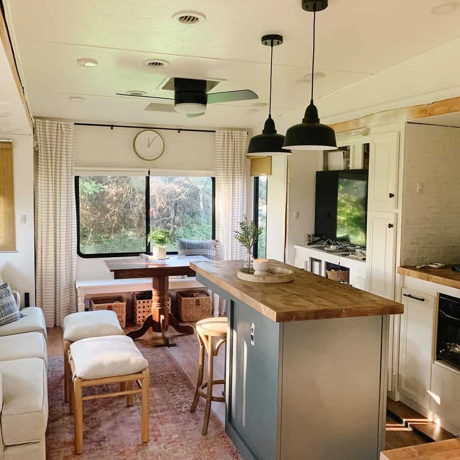 Elegant RV interior with dining area and kitchen island