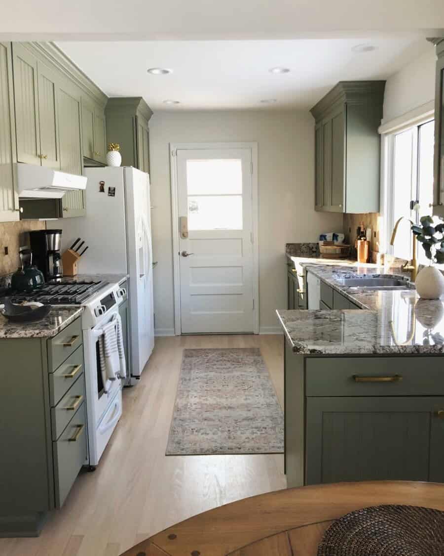 small galley kitchen with gold fixtures