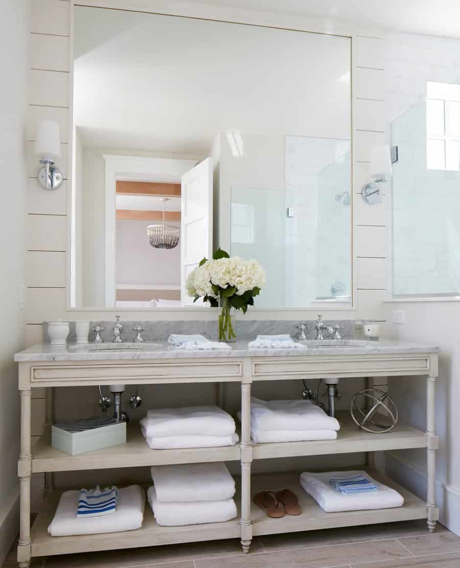 white double bathroom vanity with marble countertop and shelves