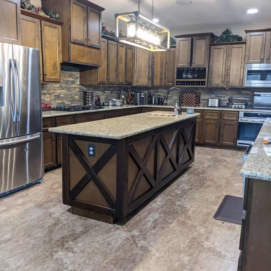 Spacious kitchen with large island and stone backsplash