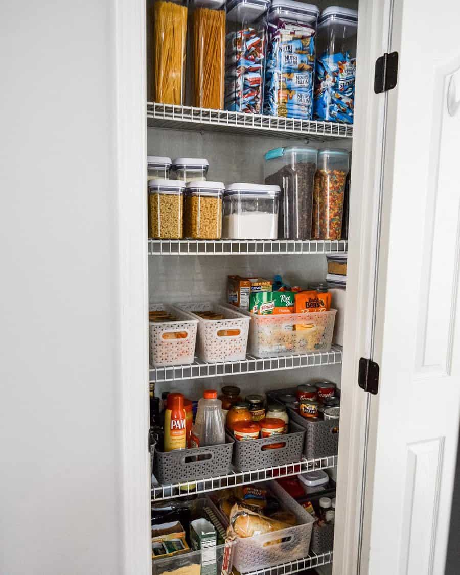 Well-organized pantry with clear containers, labeled bins, and neatly stored dry goods for a tidy and efficient kitchen storage solution