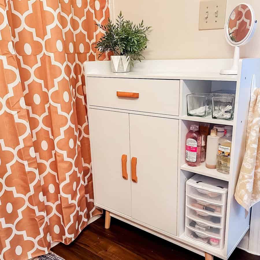 Bathroom cabinet with orange handles