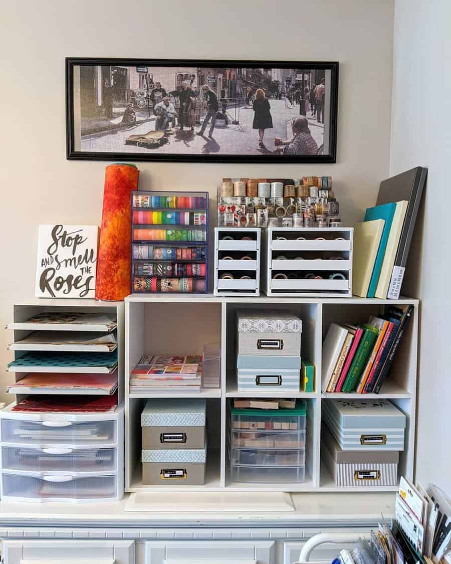 Craft storage wall with organized shelves and art decor