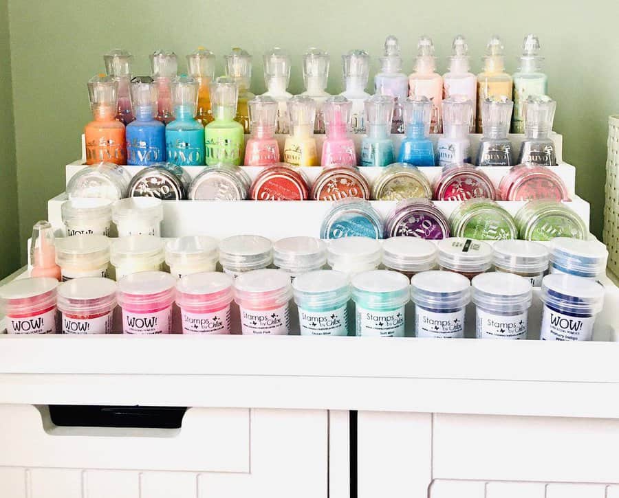 Craft pigments and powders organized on white shelves