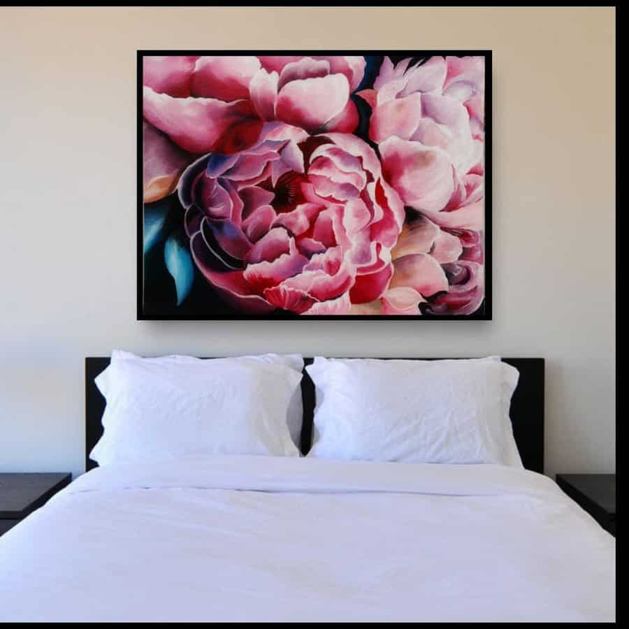 Bedroom with large floral painting above the bed