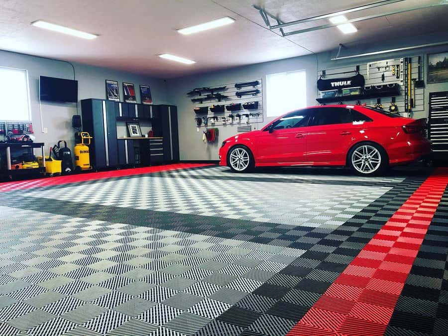 Garage with red car and patterned floor tiles