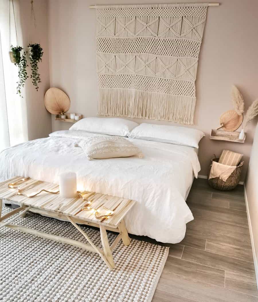 Small white bedroom with hanging plants