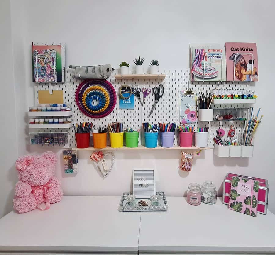 Whimsical craft space with pegboard and colorful pots