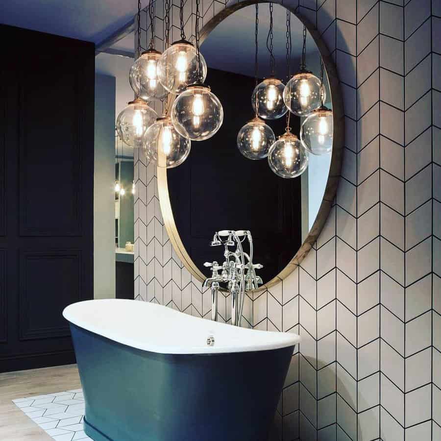 Stylish bathroom with bubble pendant lights and geometric tiles