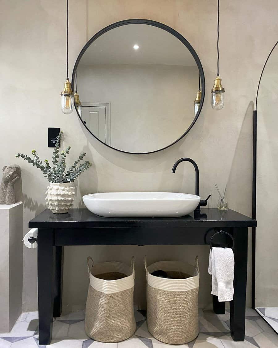 Minimalist bathroom with hanging edison lights and round mirror