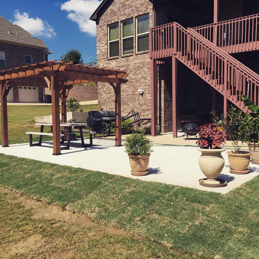 Backyard with pergola and potted plants