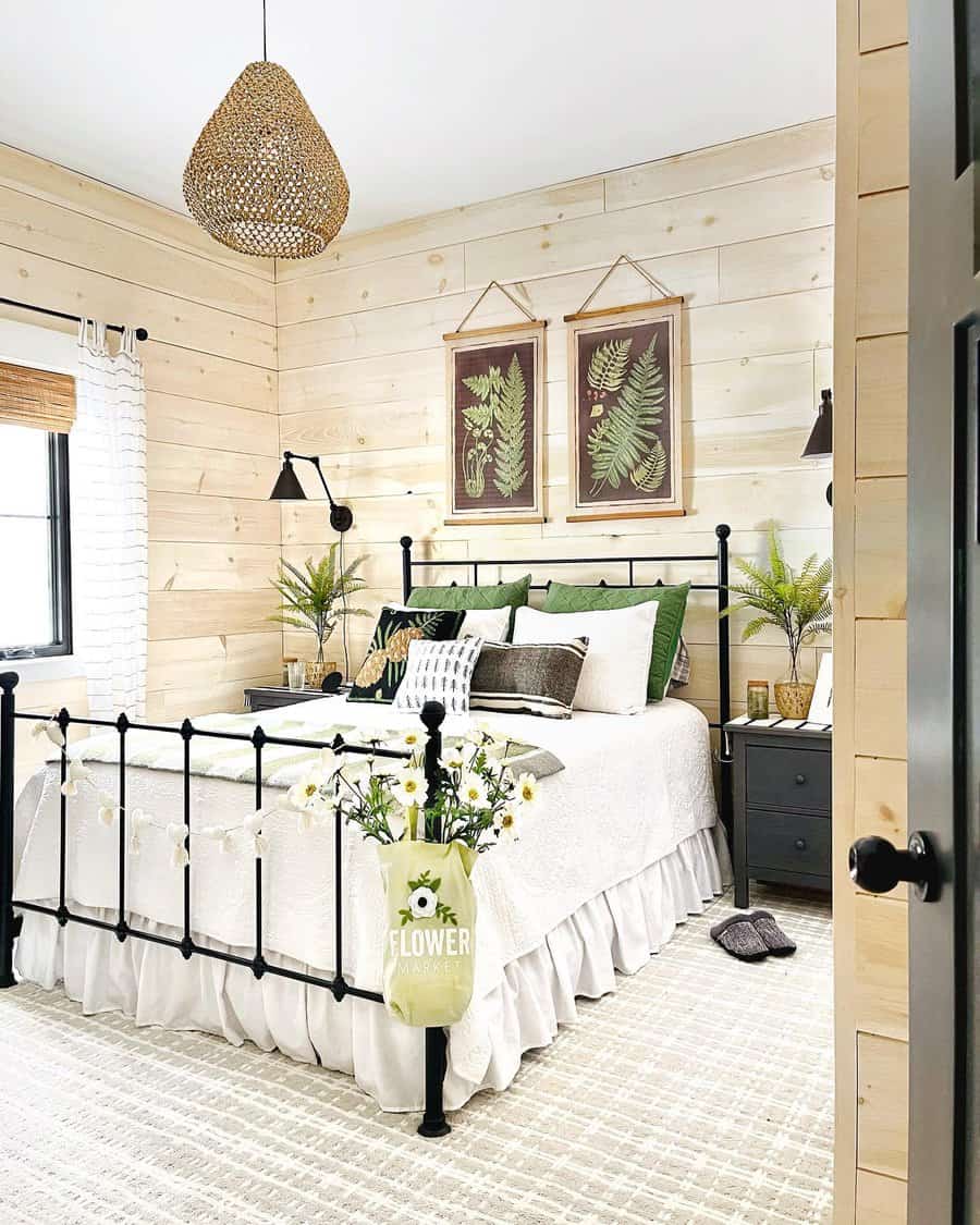 Bright bedroom with natural pine shiplap and botanical art