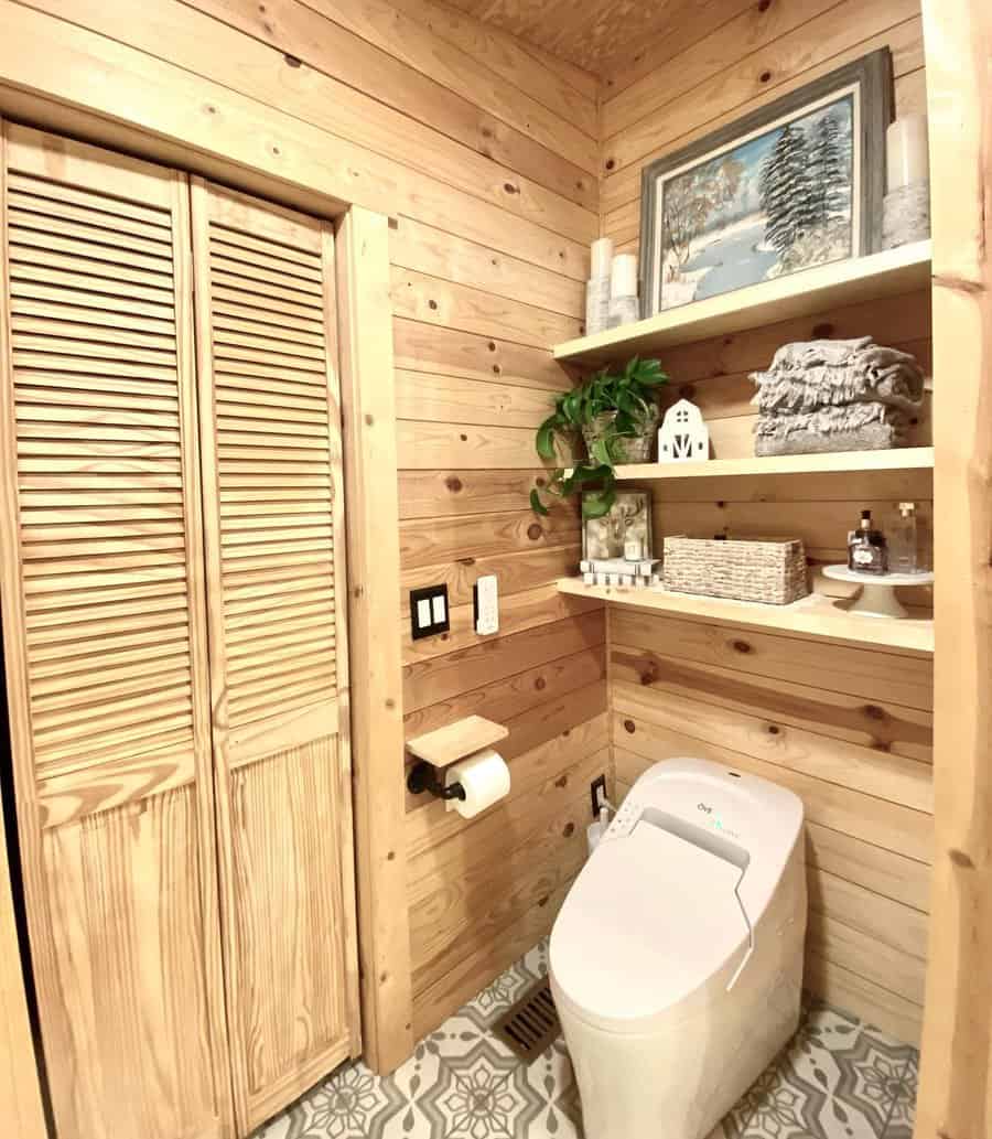 Rustic bathroom with natural wood shiplap and patterned tile floor