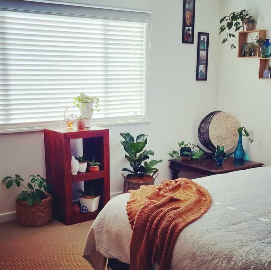 Inviting bedroom with indoor plants and wooden furniture