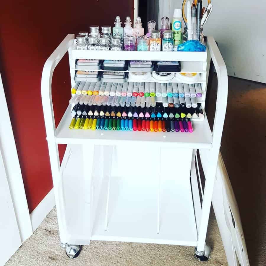 White craft cart with markers and paint