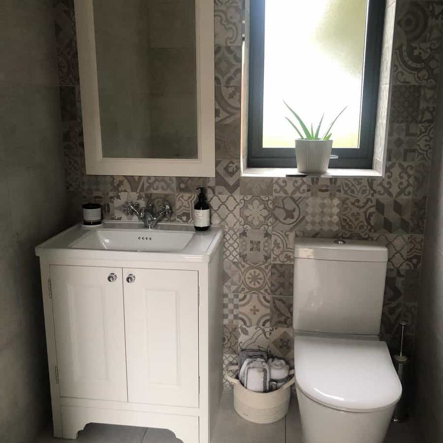 Powder rooms with light grey tones