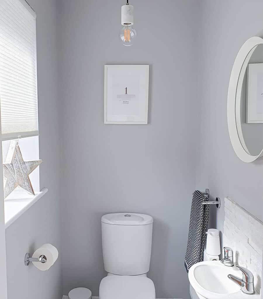 Powder rooms with light grey tones