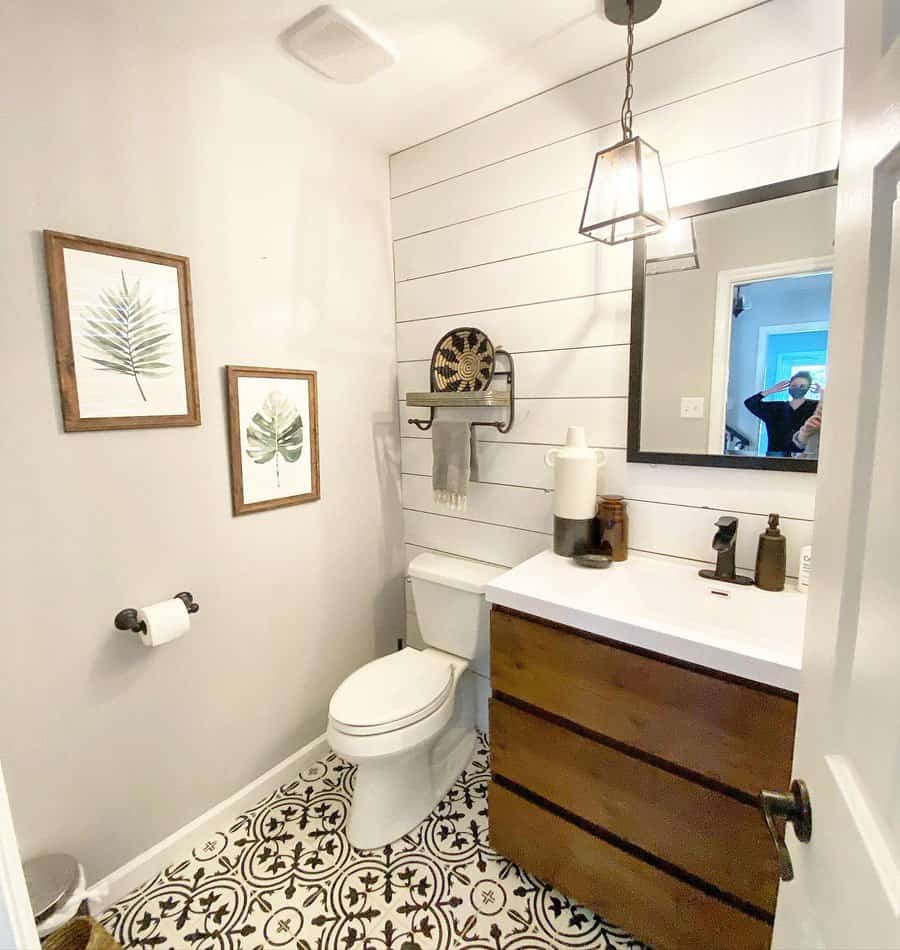 Half bathroom with decorative tiles