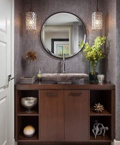 Half bathroom with statement mirror