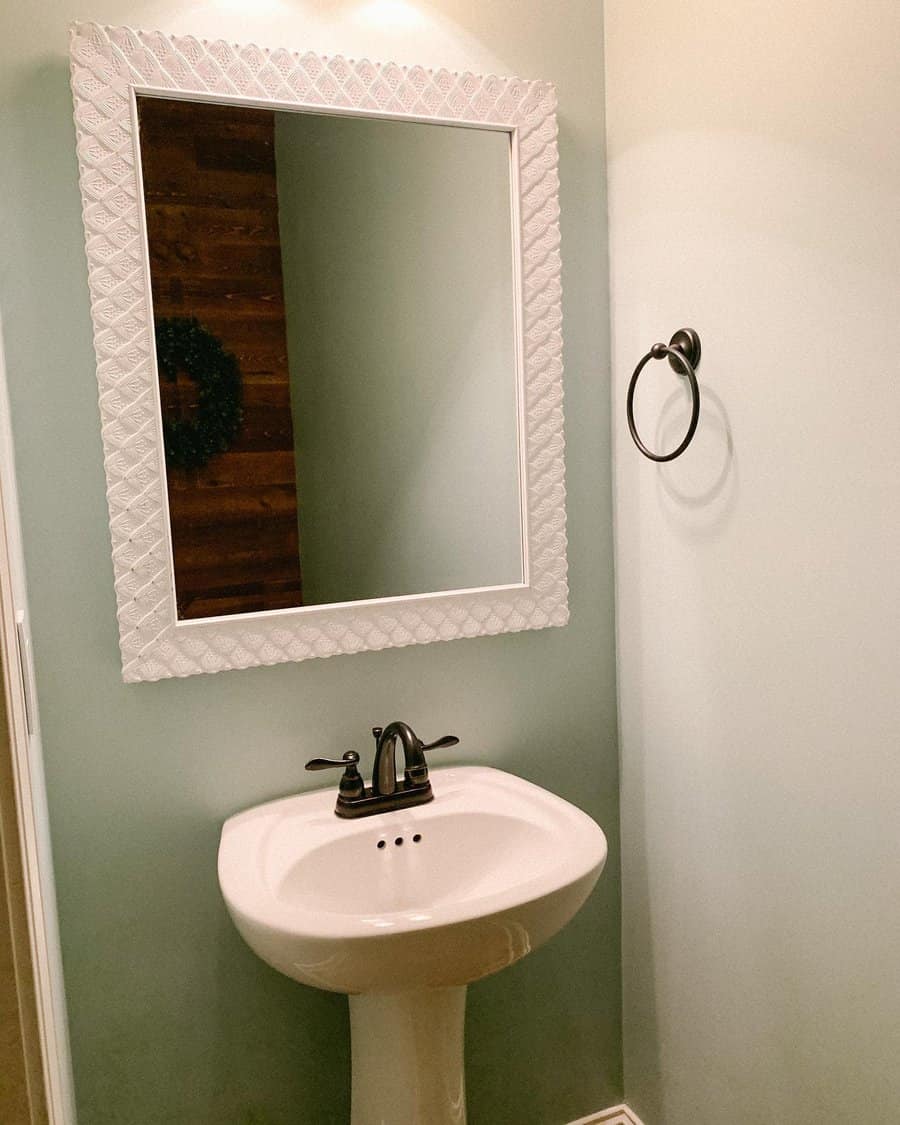 Half Bathroom With Statement Mirror