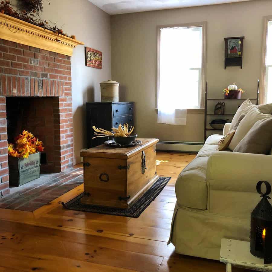 Cozy room with brick fireplace and vintage wood chest