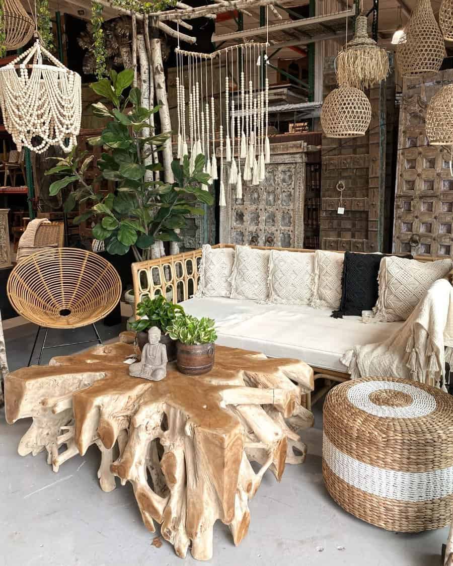 Boho-inspired rattan daybed with textured cushions, a rustic wood table, and woven decor, creating a cozy and earthy relaxation space