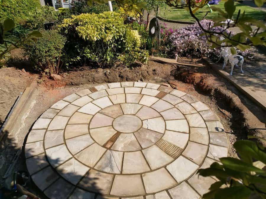 Round stone patio with garden surround in progress