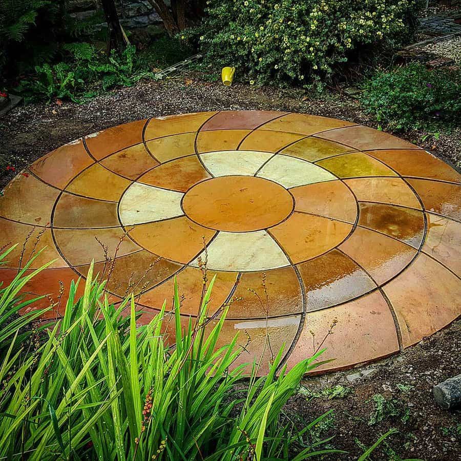 Colorful round stone patio with floral pattern design