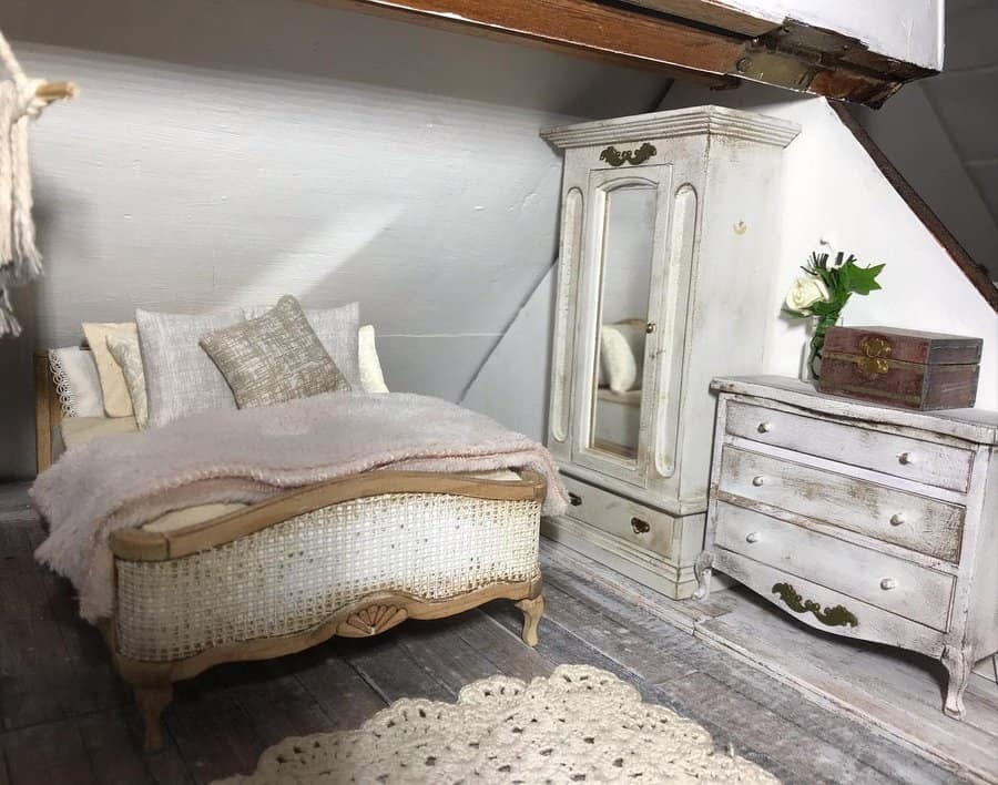 Charming attic bedroom with vintage-inspired furniture, soft pastel tones, and rustic wood details, creating a cozy and elegant retreat.