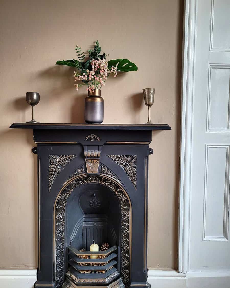 fireplace surround with gold details 
