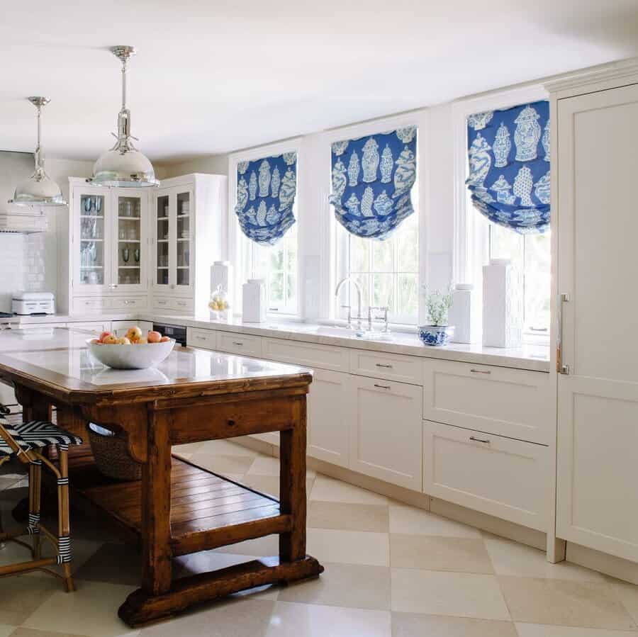 Traditional kitchen with wooden island and checkered floor