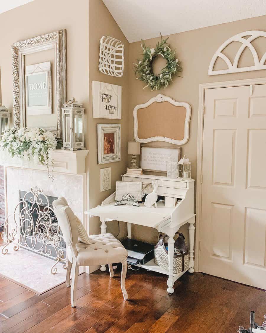 Elegant white vintage writing desk with a tufted chair, styled with rustic decor, greenery, and soft neutral tones for a cozy farmhouse feel.