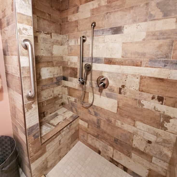 rustic walk-in shower with wood tiles