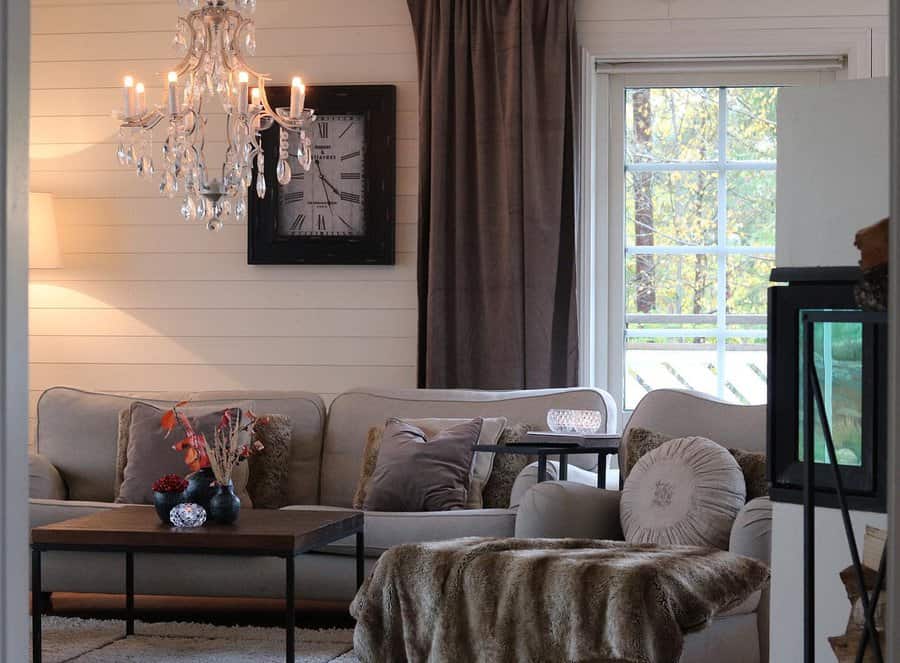 Cozy living room with chandelier and center rug