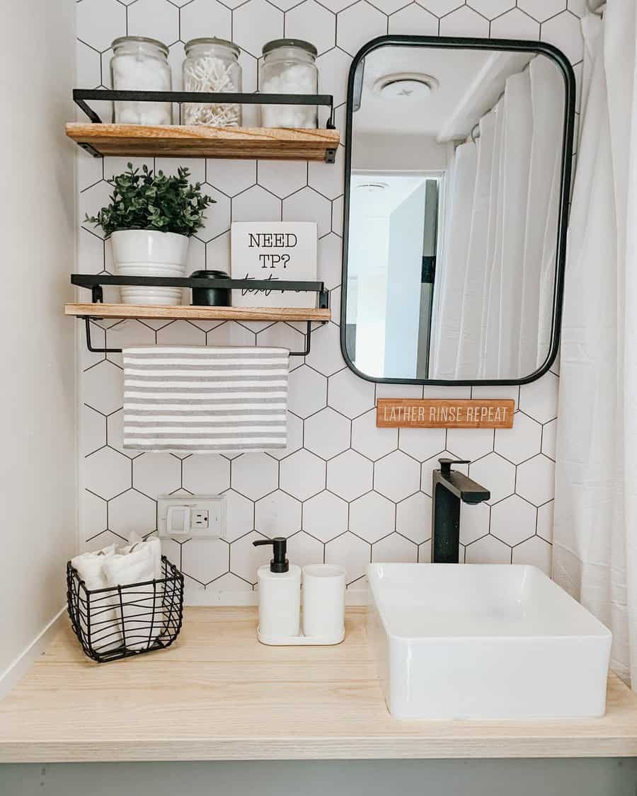 Stylish RV bathroom with hexagonal tiles and modern fixtures