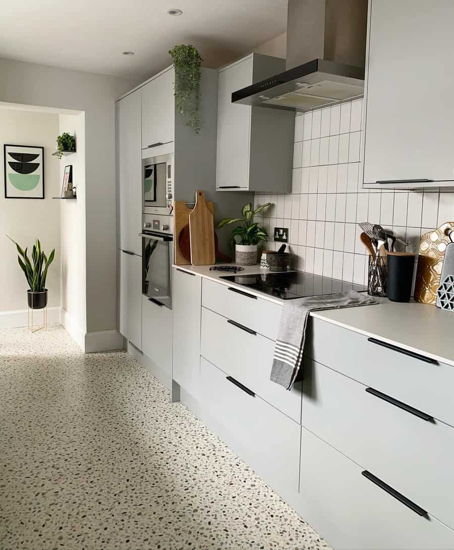 small galley kitchen with terrazzo tiles