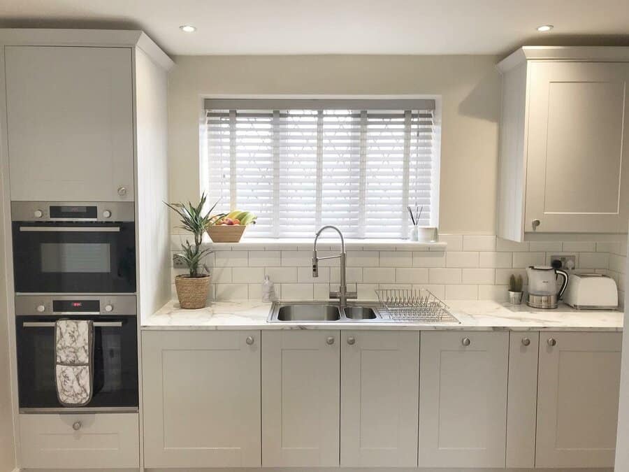 White kitchen with marble countertop