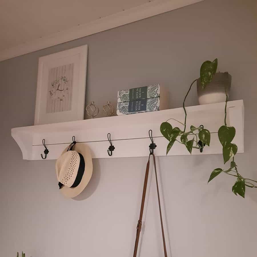 floating shelf with hat hooks