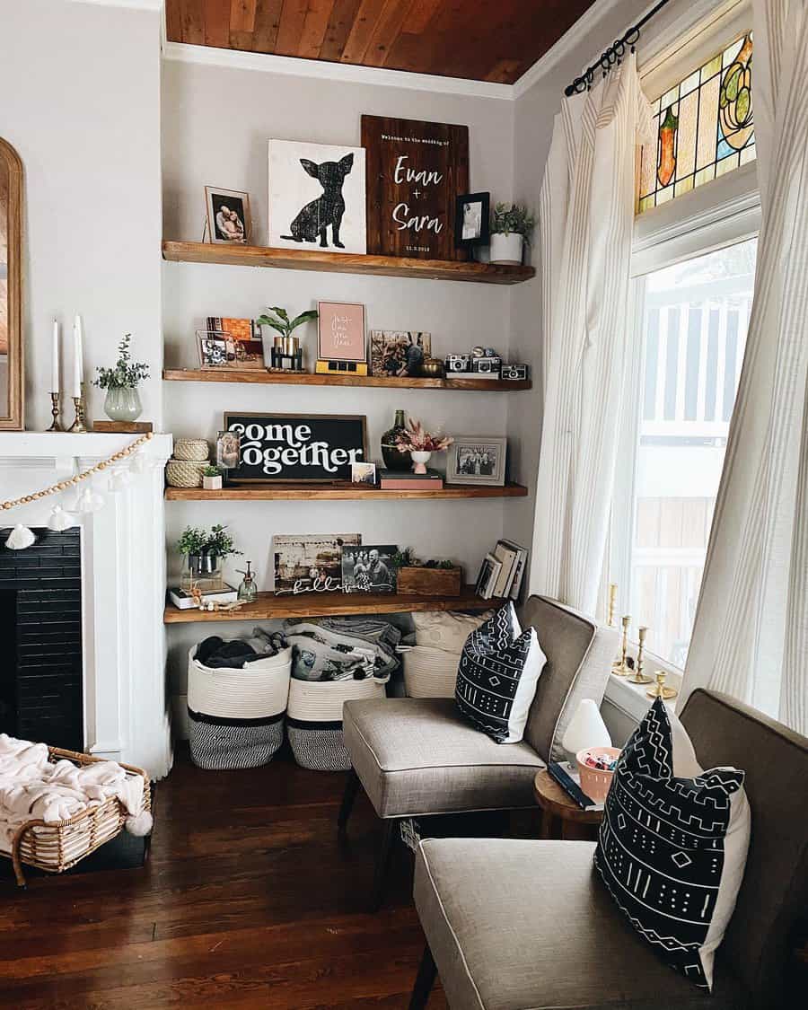 Cozy living room with decorated shelves and seating, adjacent to a fireplace