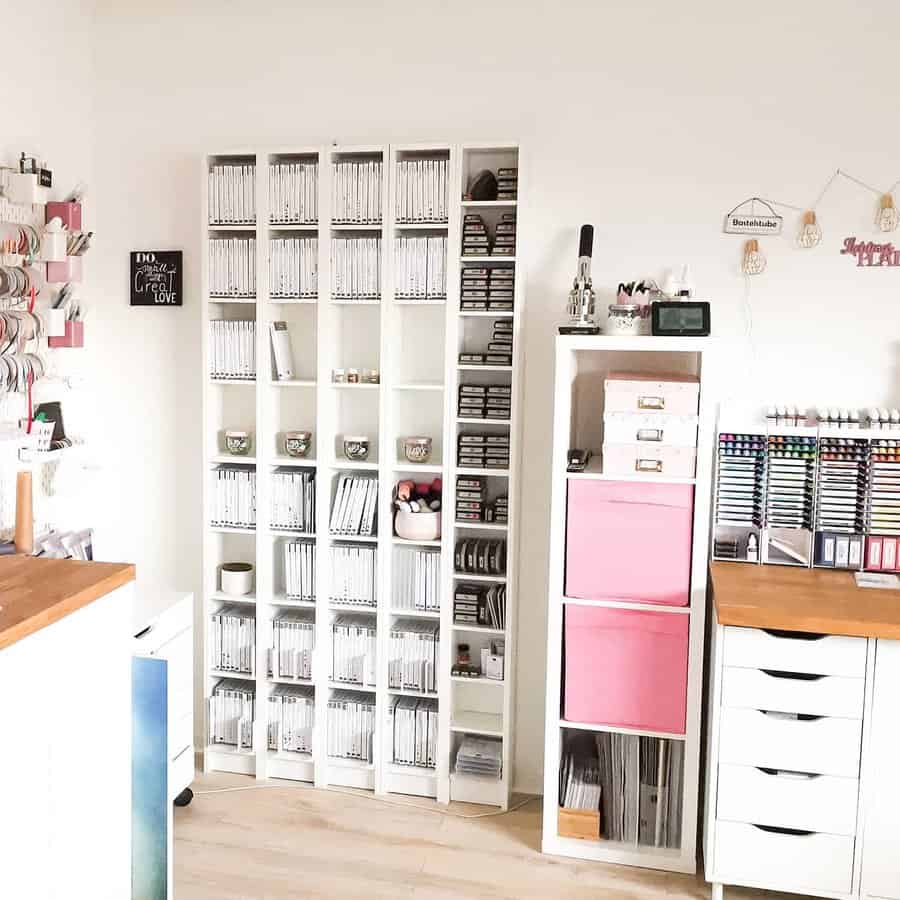 Craft room with white storage shelves and markers