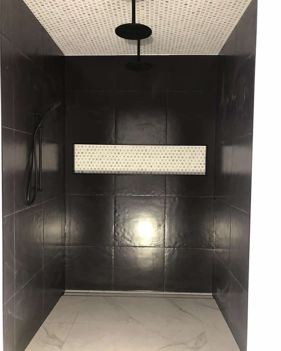 Modern shower with a black tile interior, contrasting white patterned ceiling, and dual rain showerheads, creating a sleek and luxurious look.