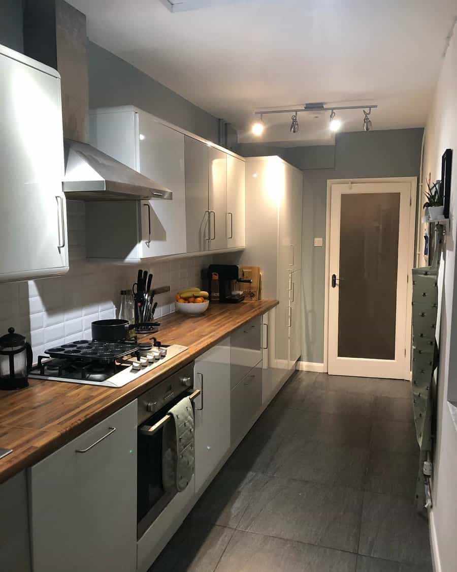 Small galley kitchen with beveled tiles