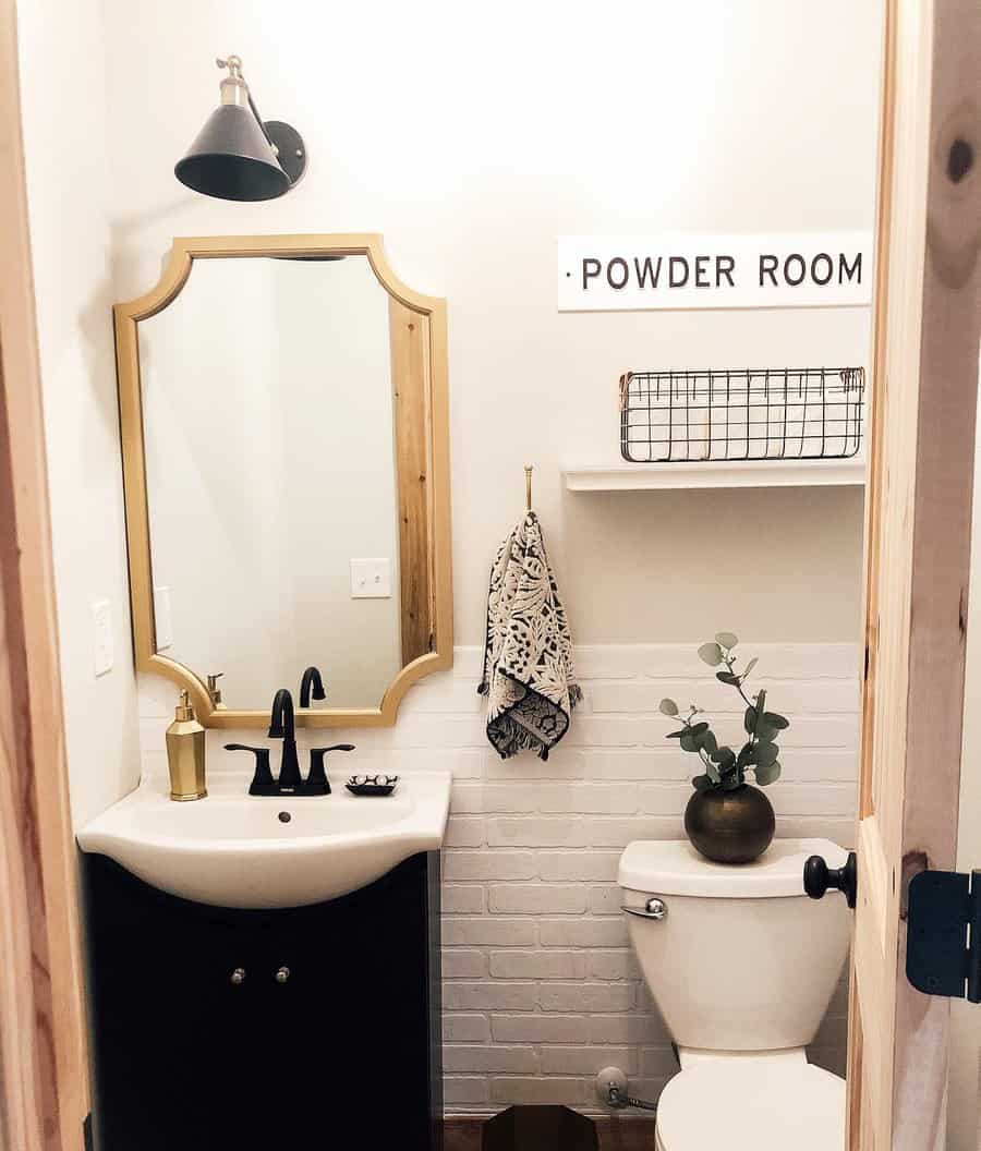 Half bathroom with black fixtures